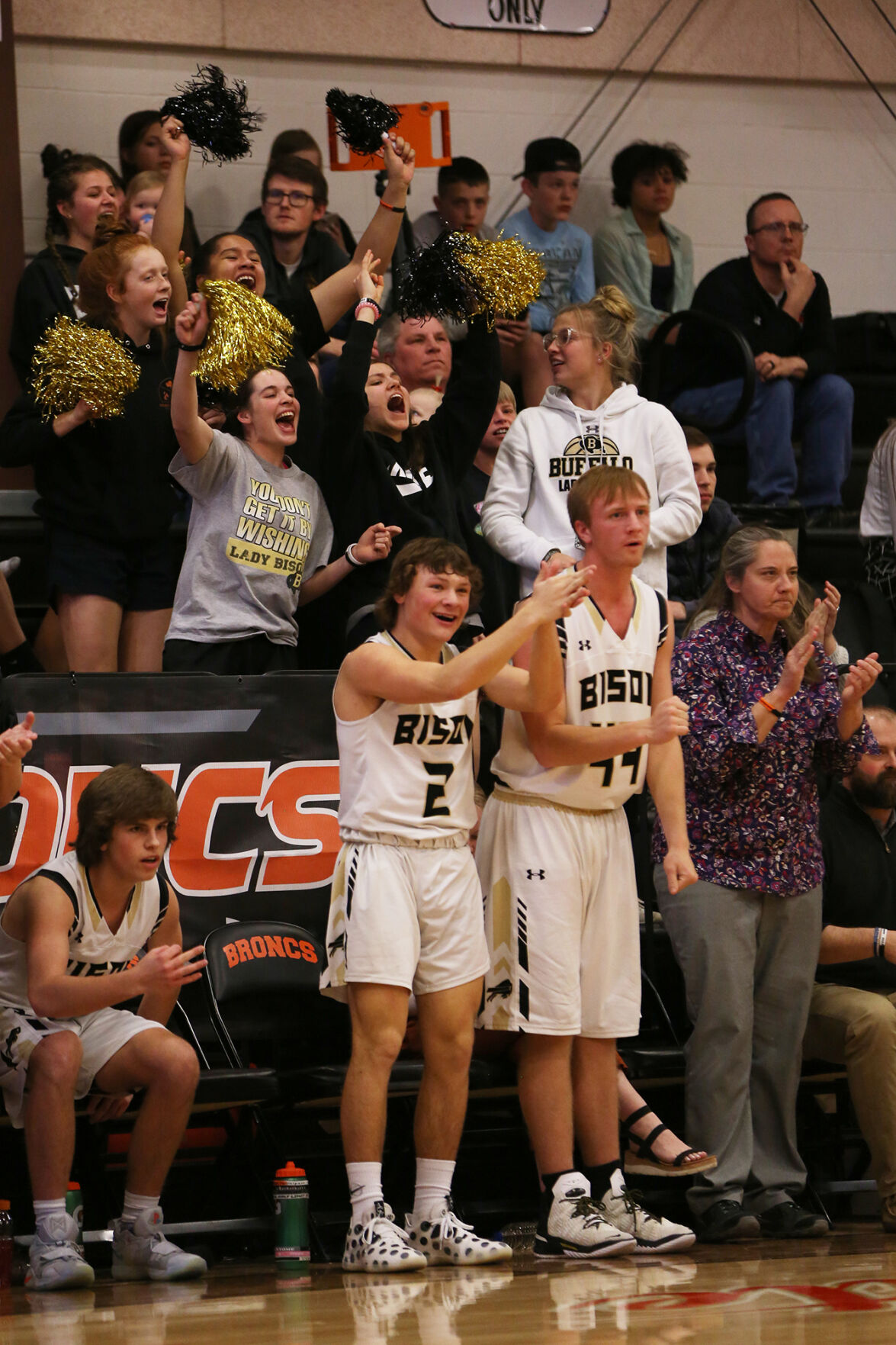 Buffalo High School’s girls basketball team screams in celebration